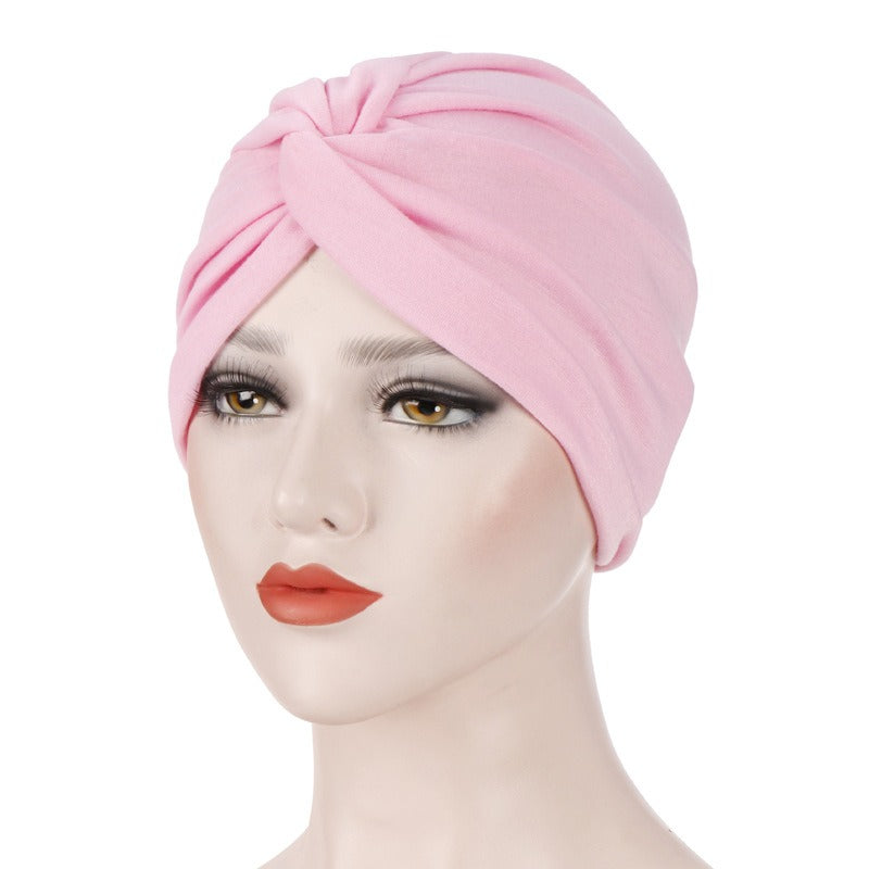 New elastic fabric with crossed candy colored twisted hat and candy colored base on the forehead